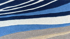 Aurora Abstract Swirl Hand Tufted Wool Rug Blue