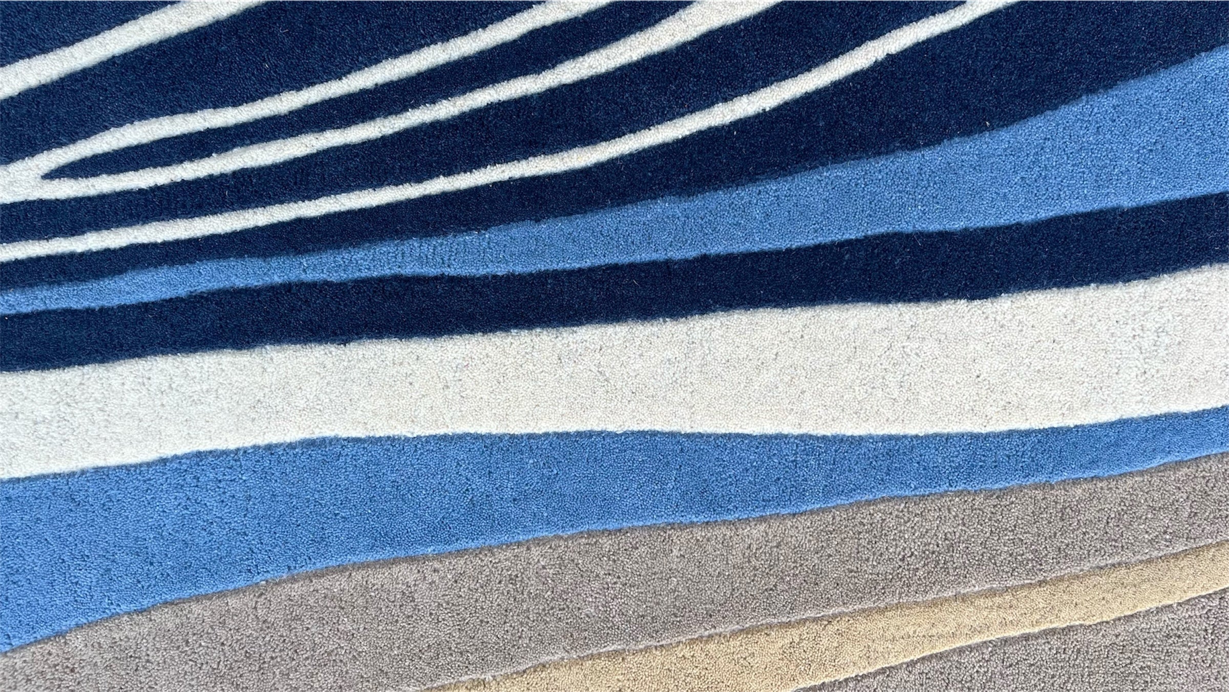 Aurora Abstract Swirl Hand Tufted Wool Rug Blue